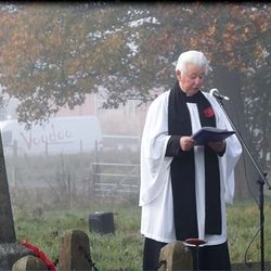 A minister leading the remembrance service at Marston.