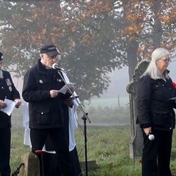 Participants standing at the remembrance service.