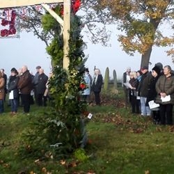 The congregation gathered around the EverGreen Arch.