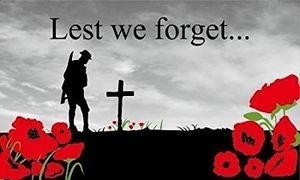 Lest we forget: a soldier silhouette, cross and red poppies.