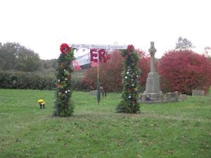 The EverGreen Arch in the churchyard, decorated for remembrance.