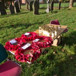 Poppy wreaths laid beside the Marston War Memorial.