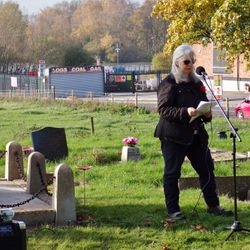 A participant reading at the remembrance service.