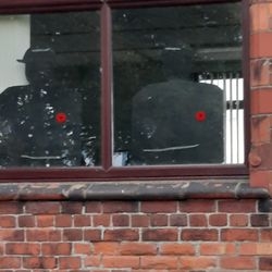 A remembrance display in a window.