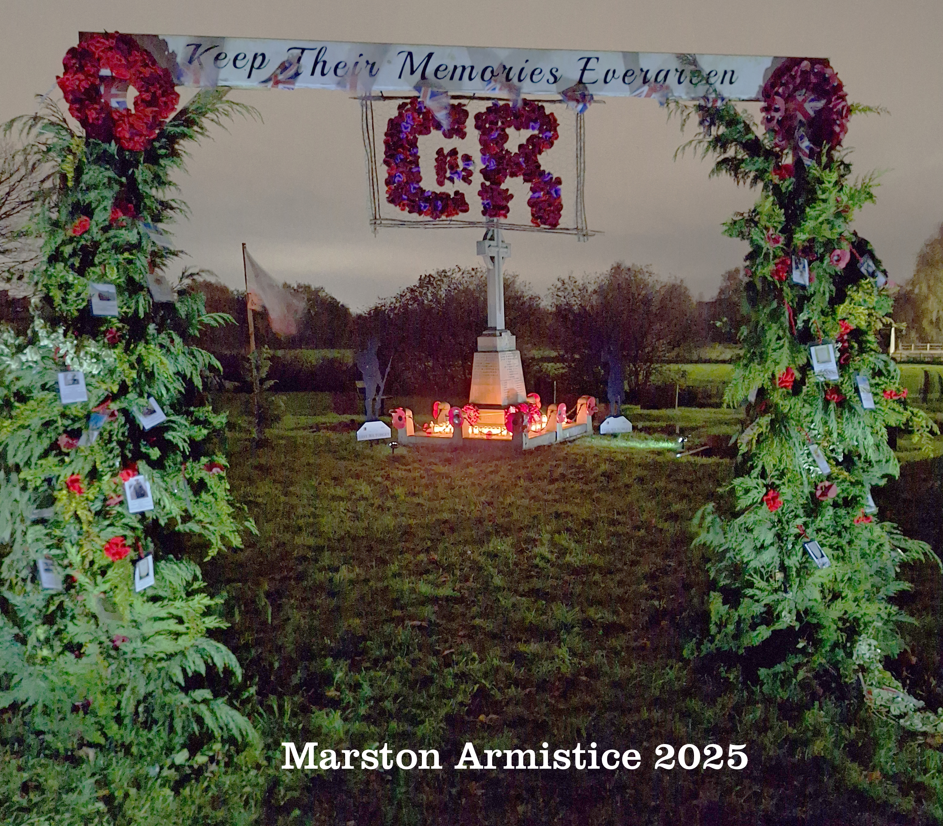 The EverGreen Arch and remembrance candles at night. Marston Armistice 2025.