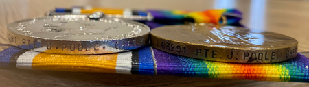 Close-up of the inscriptions on James Poole's medals.